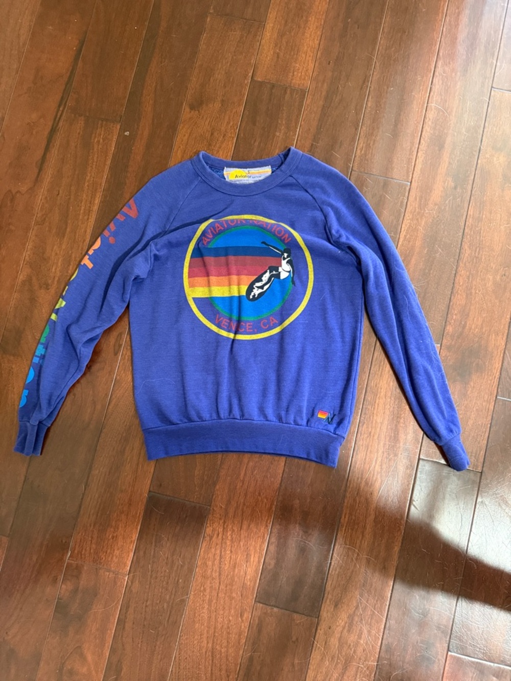 Small Aviator Nation purple sweatshirt w/ front emblem and arm lettering